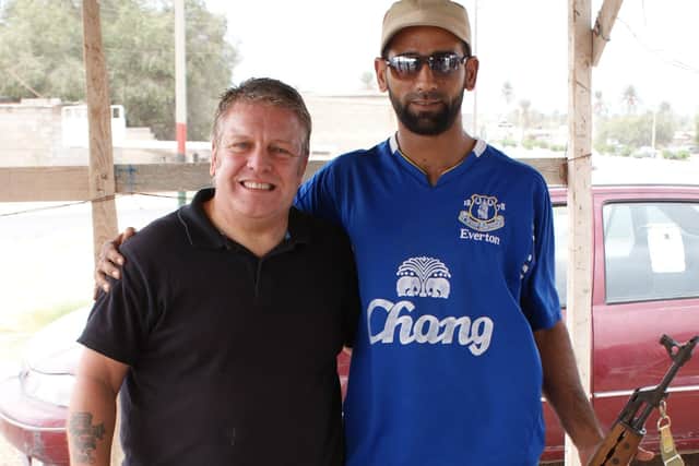 Phil at a road checkpoint in Libya manned by a friendly rebel faction. EMN-210214-175651001