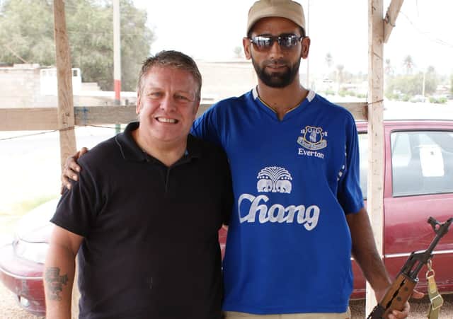 Phil at a road checkpoint in Libya manned by a friendly rebel faction. EMN-210214-175651001