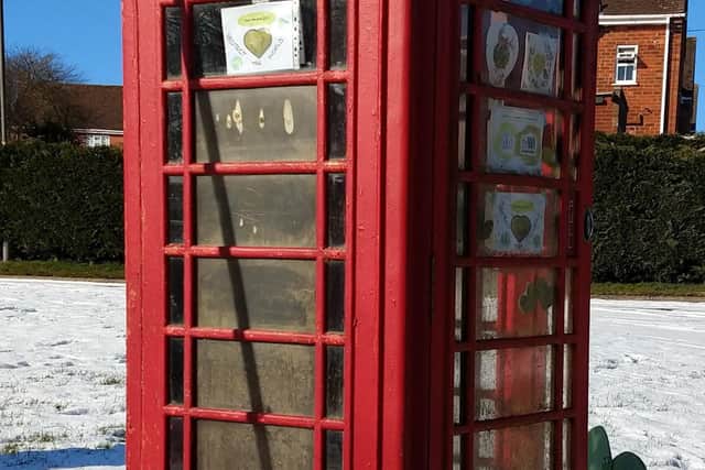 Green hearts were placed in and around Brookenby's disused phonebox
