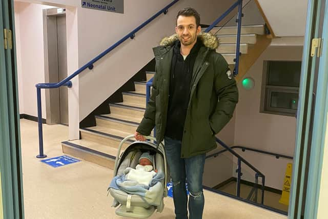 Proud dad Adam Smith with baby Charlie.