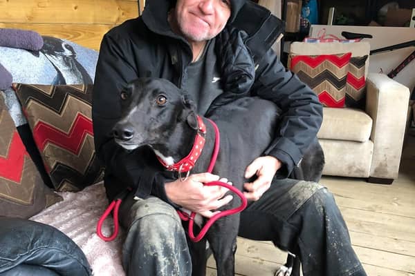 Tibby - pictured with Kevan McCormick,of Seaside Greyhounds - needs an operation costing £6,500.
