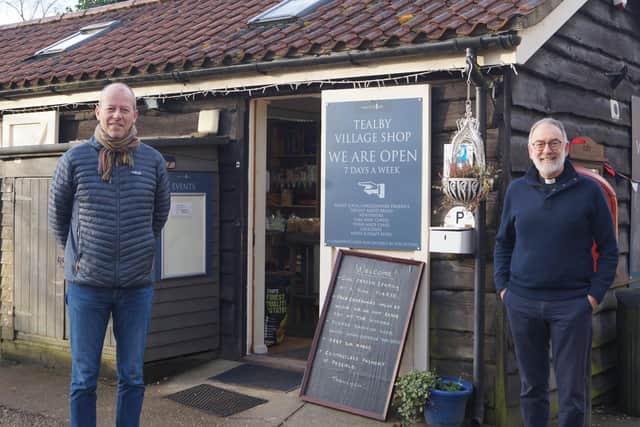 Richard Askam, left, and the Rev Chris Hewitt outside the village shop EMN-210223-084610001