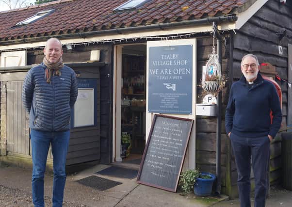 Richard Askam, left, and the Rev Chris Hewitt outside the village shop EMN-210223-084610001