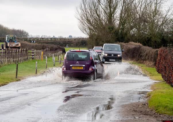 The flooded stretch of road in Mill Hill Way, South Cockerington. (Photos: John Aron)