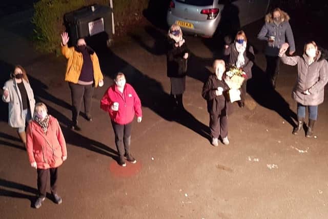 Staff from the Tiny Tots past gathered outside to surprise Janet while adhering to social distancing.