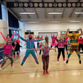 Brightly coloured Church lane School staff join in the Mr Motivator session. EMN-210103-104126001