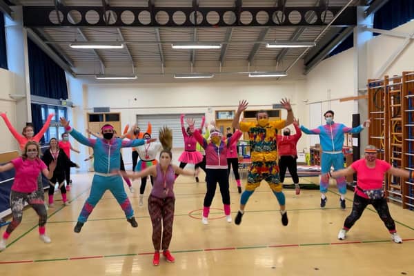 Brightly coloured Church lane School staff join in the Mr Motivator session. EMN-210103-104126001