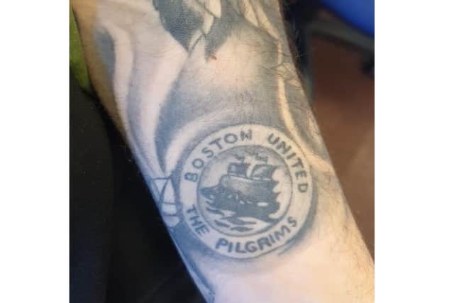 His club on his sleeve! Coach Driver Dave Stewart has taken the Pilgrims on  many an away day. He has the club crest on his arm.