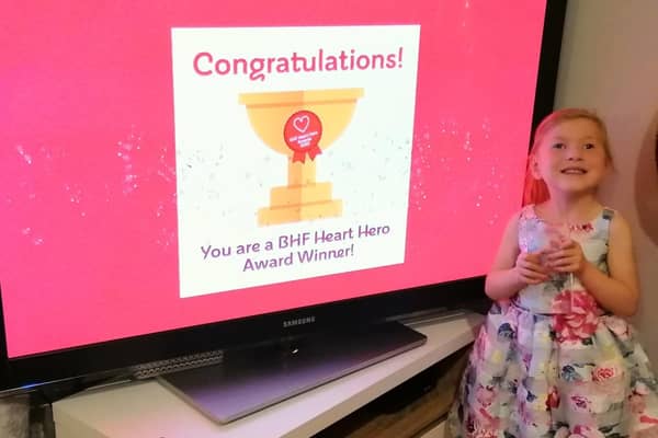 Heart Hero 2020 award winner Sophia Marshall celebrates with her Young Heart Hero Award