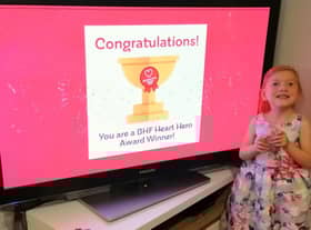 Heart Hero 2020 award winner Sophia Marshall celebrates with her Young Heart Hero Award