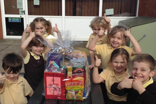 Pupils happy with their gift for the police.