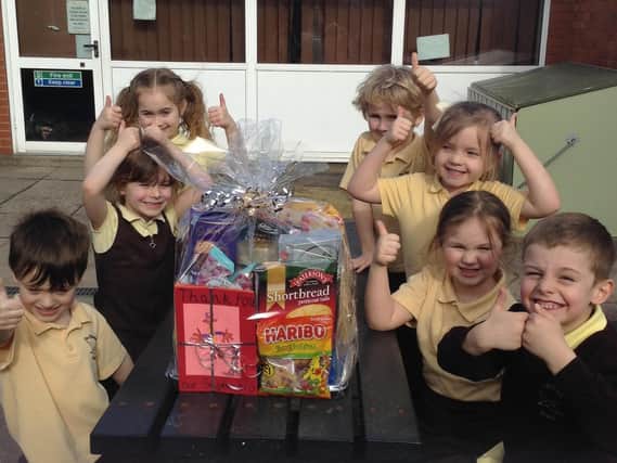 Pupils happy with their gift for the police.