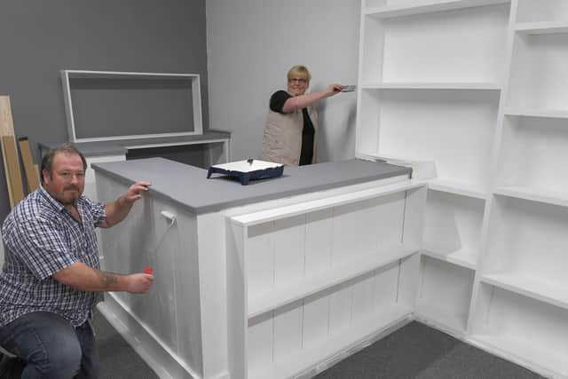 Tony and Karen Simpson getting the Gift Box ready for opening.