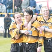 Clare celebrates with Dean West and Simon Rusk.