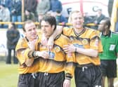 Clare celebrates with Dean West and Simon Rusk.