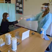 Frances Green, Somercotes Academy Principal, and Testing Assistant Hannah Teagle at one of the Covid-19 testing stations in the county. EMN-210103-134606001