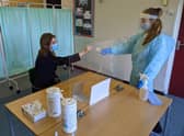 Frances Green, Somercotes Academy Principal, and Testing Assistant Hannah Teagle at one of the Covid-19 testing stations in the county. EMN-210103-134606001