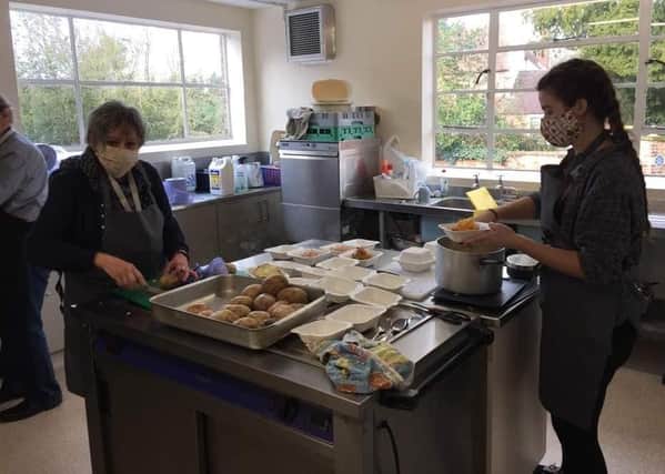 Volunteers at work preparing the free packed lunches