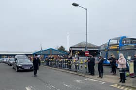 The funeral procession passes by the Stagecoach bus station. Photo: John Byford.