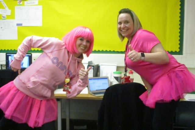 Church lane School staff all dressedup for the fitness session with Mr Motivator. EMN-210303-130855001