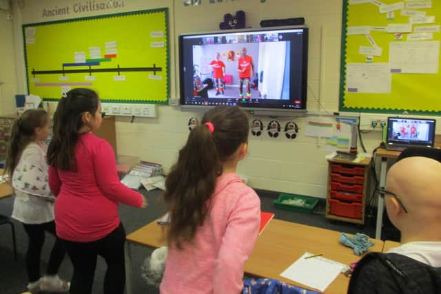 Youngsters who are children of key workers join in with the workout at Church Lane school. EMN-210303-130834001