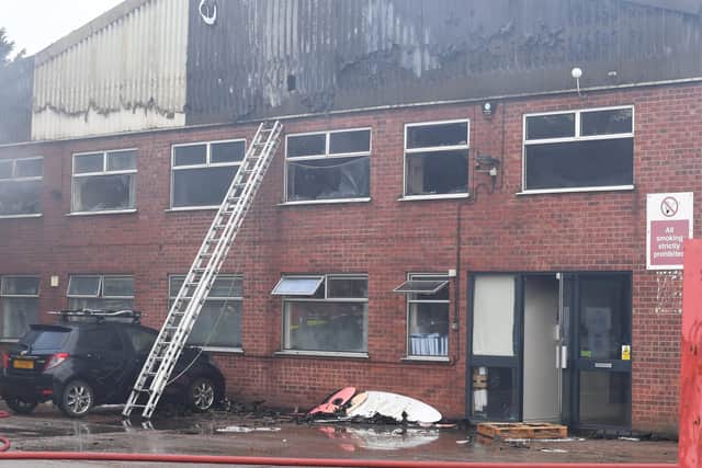 The smokey factory building. EMN-210403-165909001