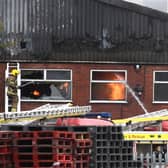 Flames still springing up inside the factory building in Heckington this afternoon. EMN-210403-170107001