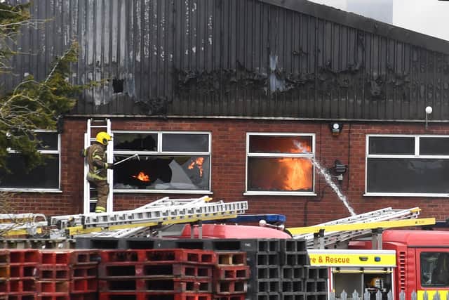 Flames still springing up inside the factory building in Heckington this afternoon. EMN-210403-170107001