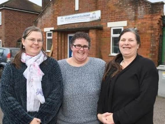Pictured outside the Spilsby Christian Fellowship building where the uniform bank is located are (from left) Trish Freeman, Vicki Ireland and Judith Coe .