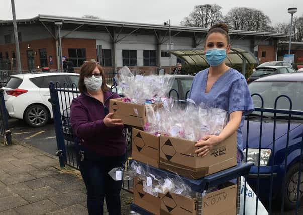 Jackie Hudson-Hay, of Kirton Holme, handing over the ‘pick me up’ packs to Nicola Hooker, a deputy sister on Pilgrim Hospital’s Intensive Care Unit.