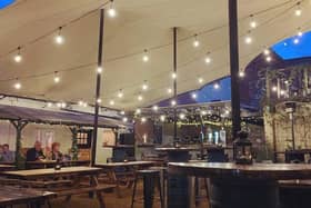 The illuminated stretch tent canopy over Watergate Yard, Sleaford. EMN-210603-140142001