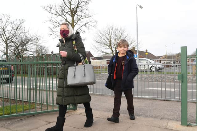 Glad to be back: Sarah Collier of Skegness with Albie Collier, 8