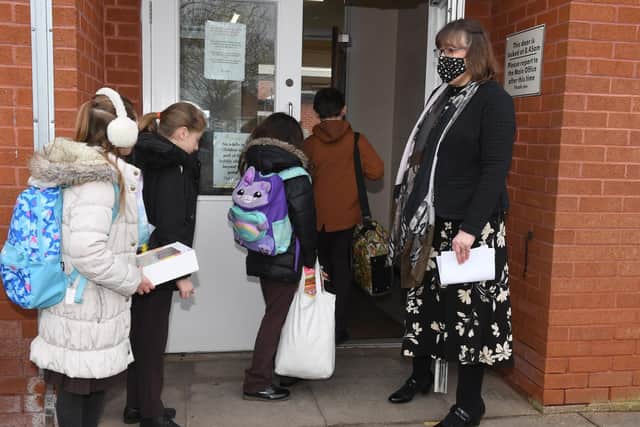 Headteacher Mrs Caroline Wellsted welcoming Year 4 pupils (from left) Isla Graham, Rudi Thompson, Amy Andrews and Oscar Shuard.
