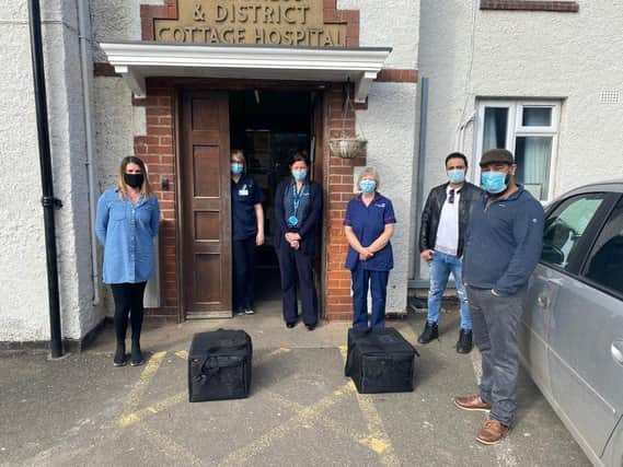 Skegness Hospital staff receiving free meals from Sunny Singh of Downtown Pizza in Ingoldmells