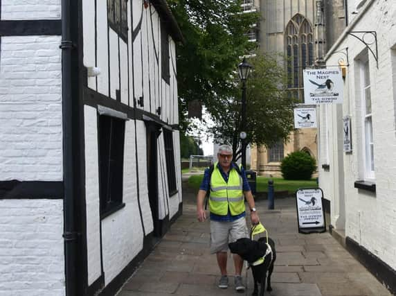 Colin and his Guide Dog Orlando out and about in Boston.