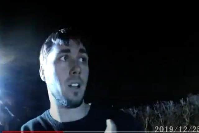 Matt Topham speaking with a police officer after the collision. (Video/Image: Lincolnshire Police)