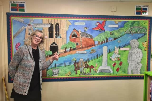 Park Academy teacher Margaret Clark with one of the school's new internal displays which was installed ready for pupils' return this week