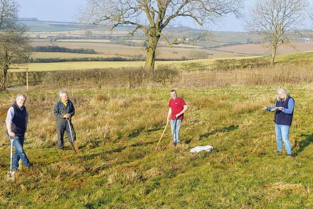 What a  view:  Parish council chairman John Smith (extreme left) joins volunteers at the site which offers stunning views of the Wolds