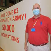 Medical director of the Grantham and Sleaford Primary Care Network of surgeries, Dr Adriaan Van Biljon, celebrates hitting over 50,000 vaccinations in the area. EMN-210322-175358001