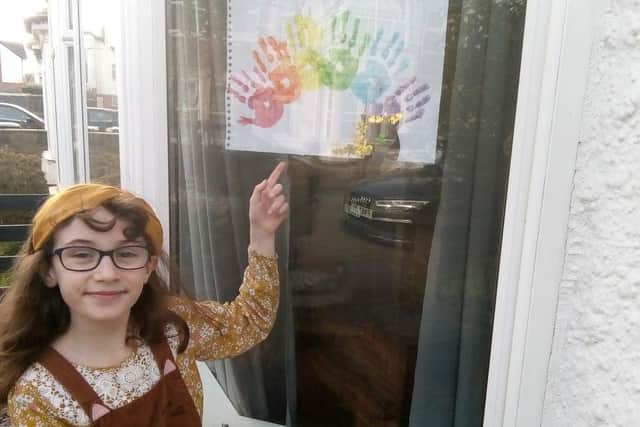 Children in Skegness painted rainbows to spread a message of hope. Here is Erin Sherwood with her picture.