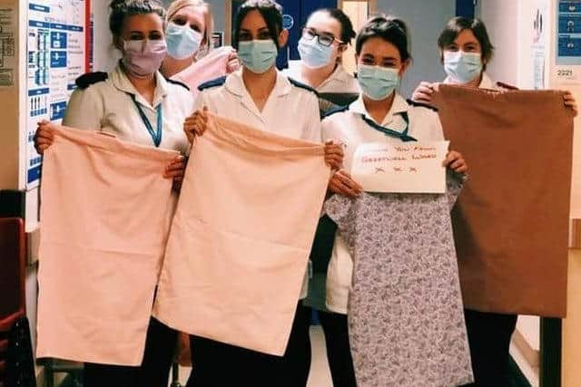 Nurses with some of the scrubs bags made by Skegness sewers.