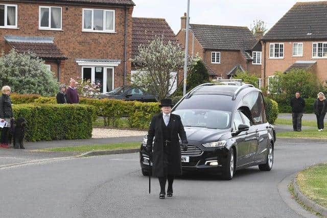 An emotional funeral procession begins for Jeannette Field, watched by neighbours in Skegness.
