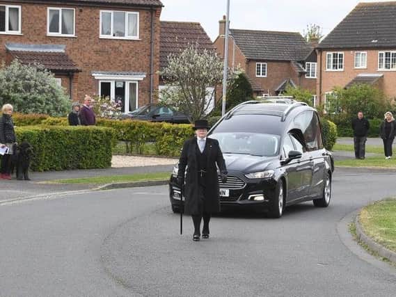 An emotional funeral procession begins for Jeannette Field, watched by neighbours in Skegness.