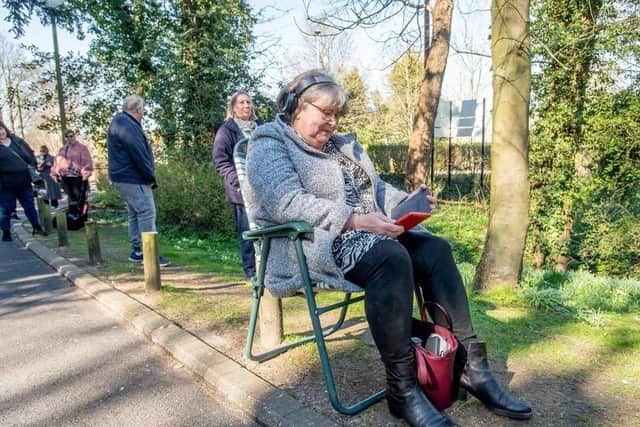 People waiting to collect their prescriptions