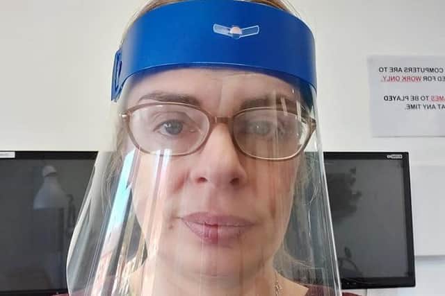 Head of technology at Boston High School, Emma Whitton, wearing one of the face visors they created. EMN-210323-143810001