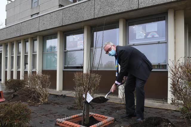 Mr Morgan plants a tree at Boston Pilgrim