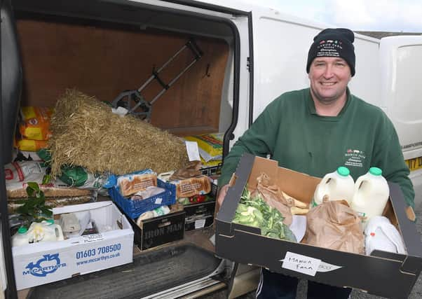 Leasingham Manor Farm Shop & Garden Centre and The Ploughmans Barn, Danny Lidsey loading deliveries for those who are self isolating. EMN-210323-114032001