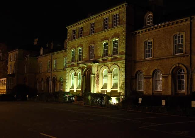 NKDC offices lit up yellow for day of reflection EMN-210324-101006001