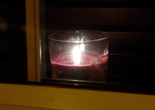 Candle in window EMN-210324-100955001