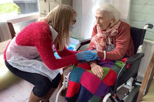 Sandi Salt meeting up with her mum, Gladys Hatcher at Ashdene. EMN-210329-190743001